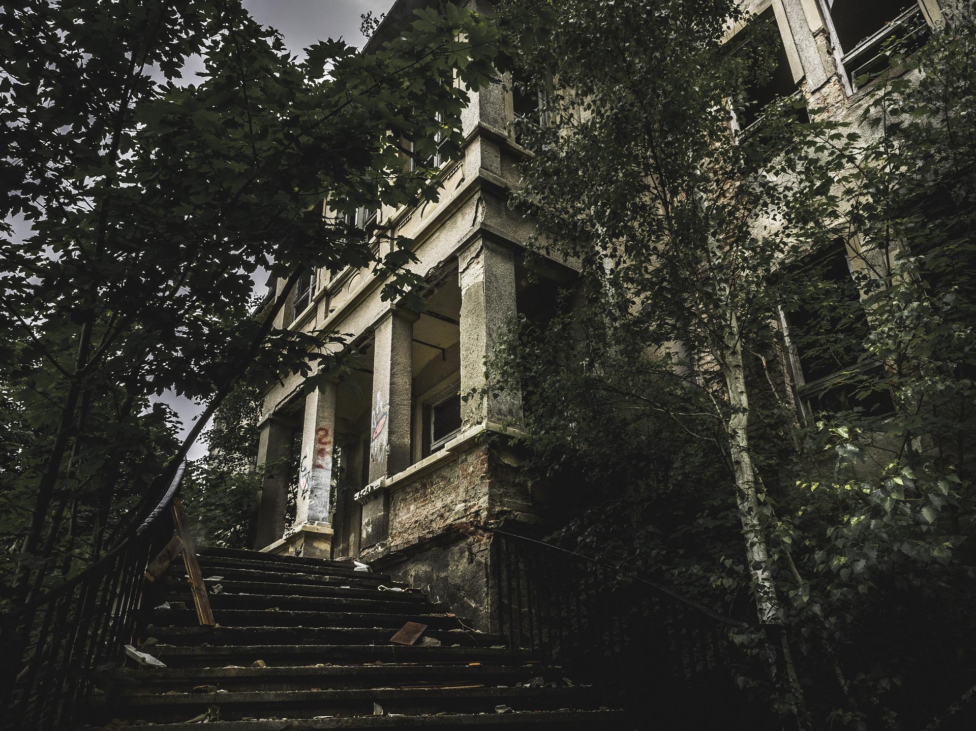 The entrance to a big abandoned house.