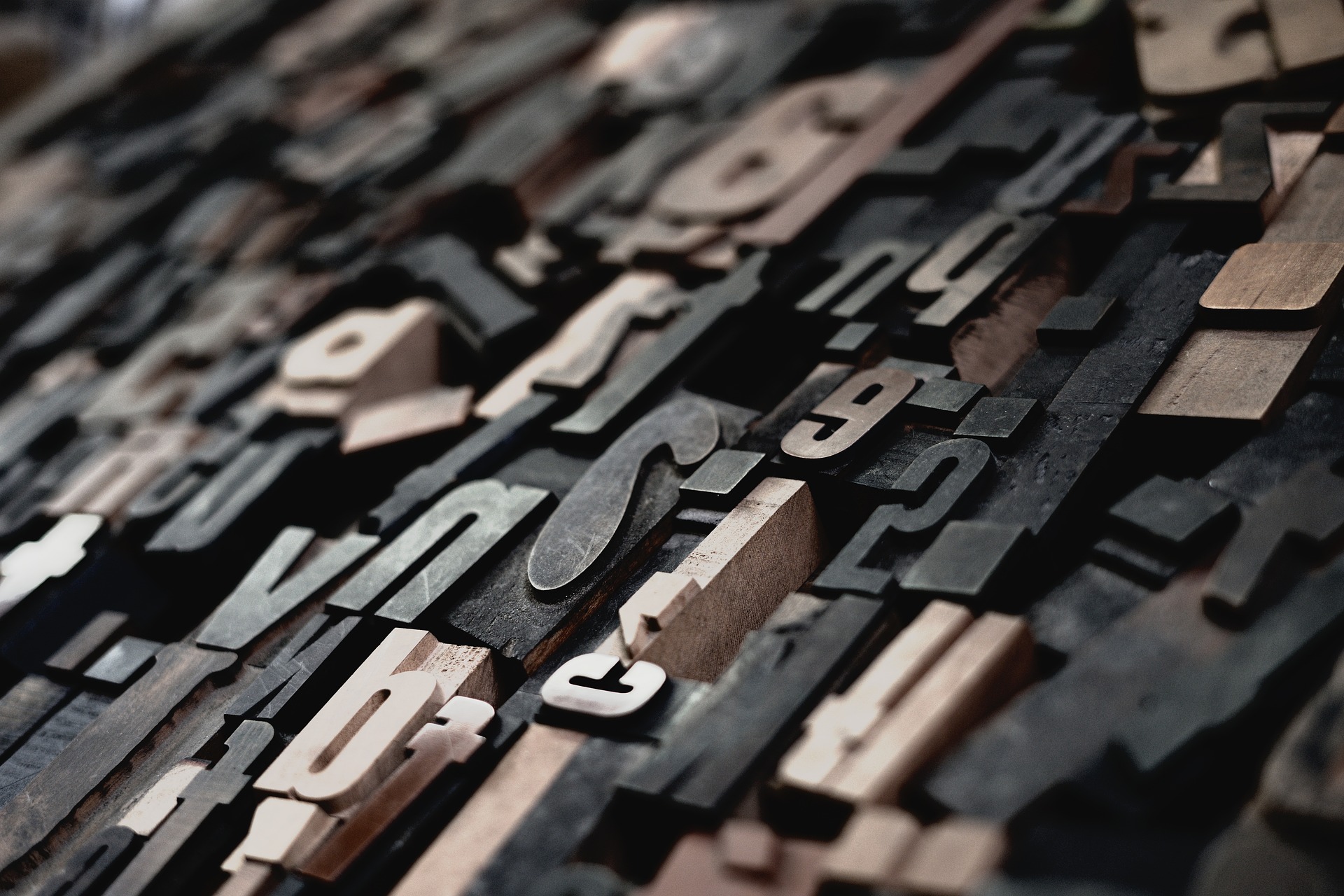 A jumble of metal types showing letters.